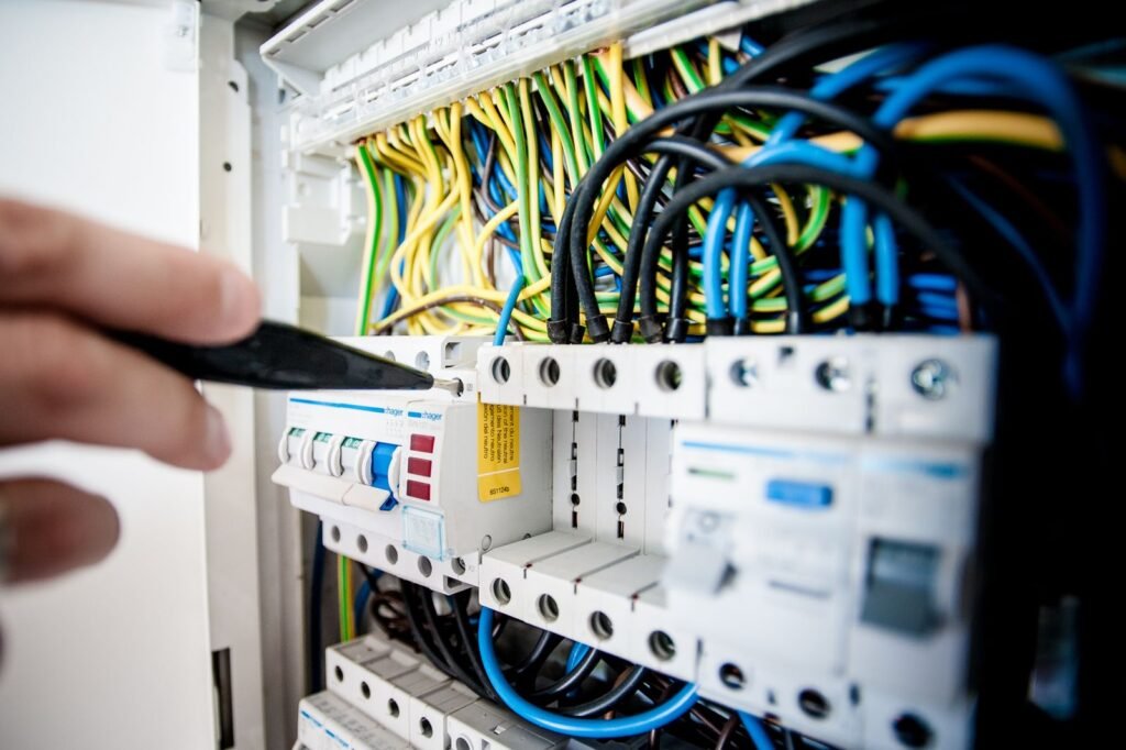 Electrician fixing an opened switchboard - switchgear buyers guide Hyderabad